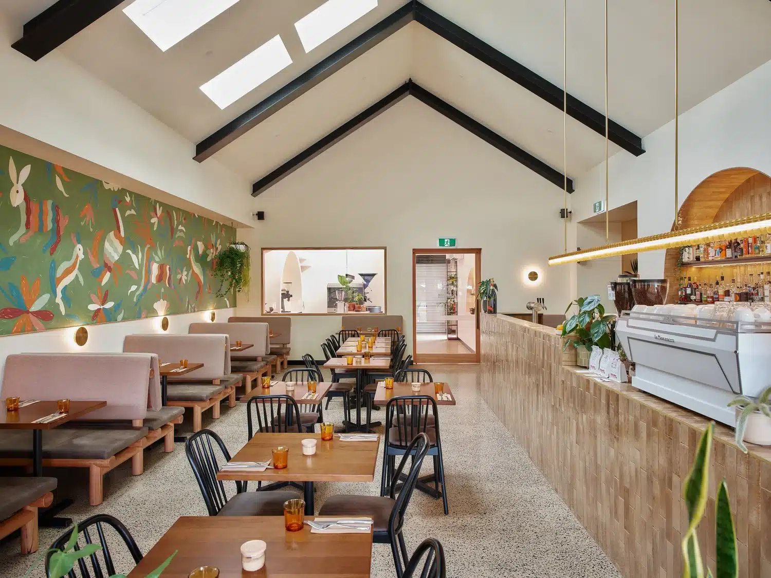 The Locavore Studio dining room with mural, banquettes and coffee bar