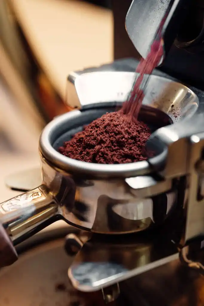 Freshly ground coffee in a portafilter at Proximal Coffee Roasters