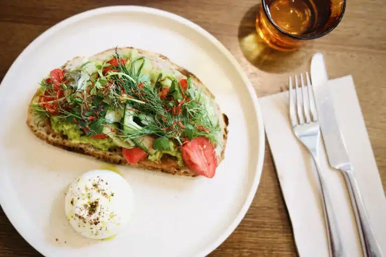 Smashed avocado on sourdough with a poached egg
